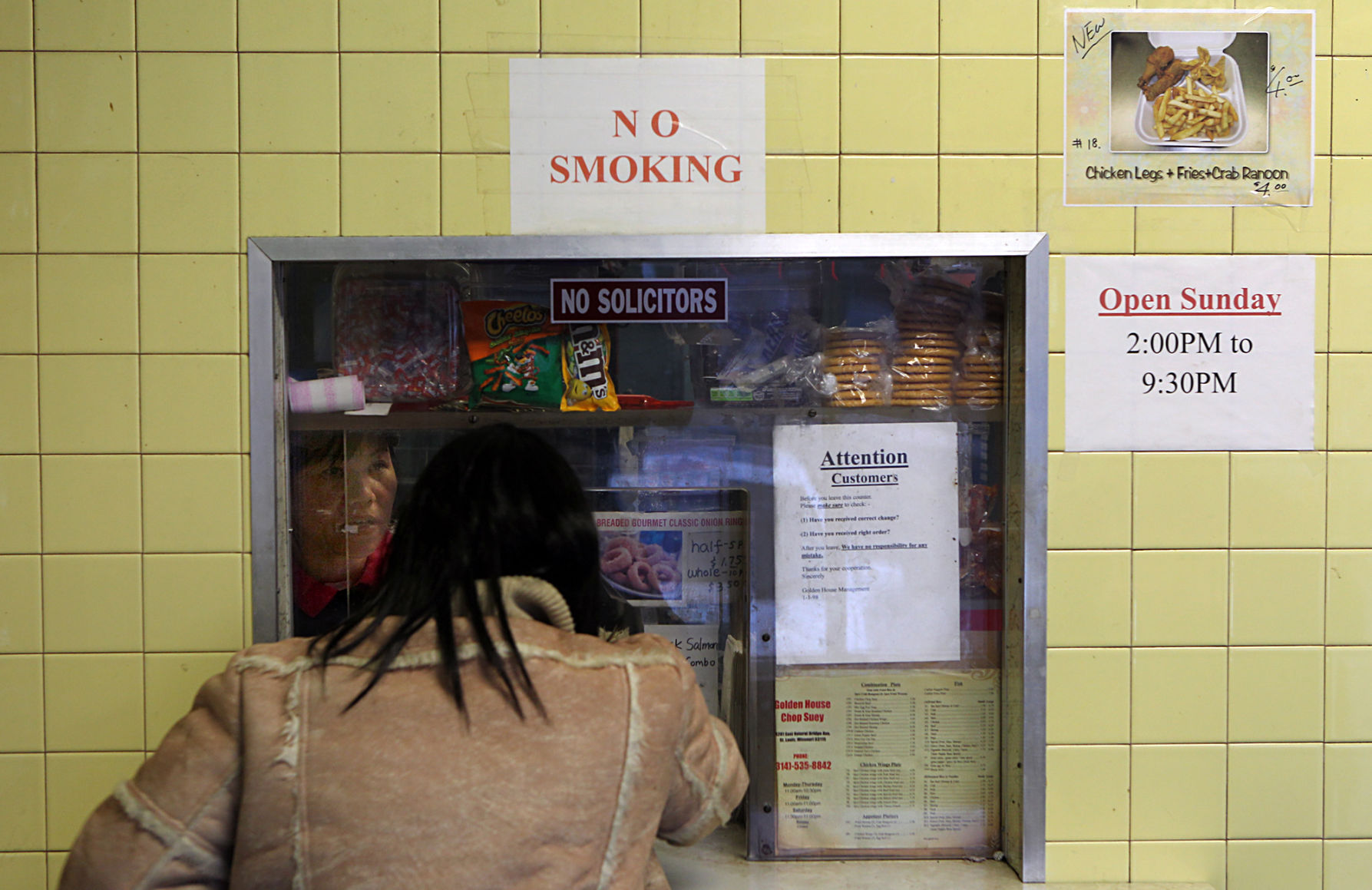 Customer places an order at Golden House Chop Suey in St. Louis